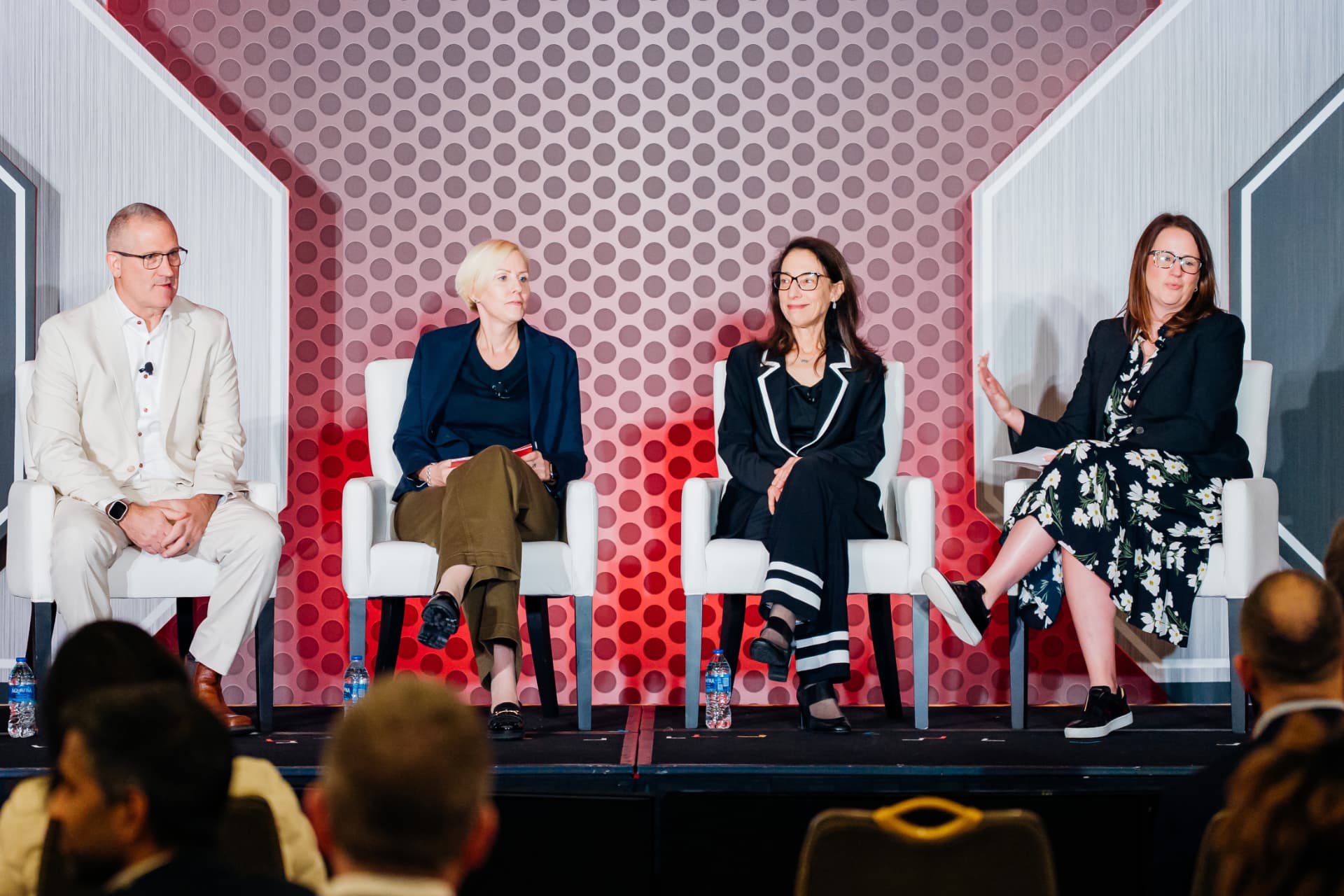 Corporate event photography of an executive panel discussion at a Miami conference
