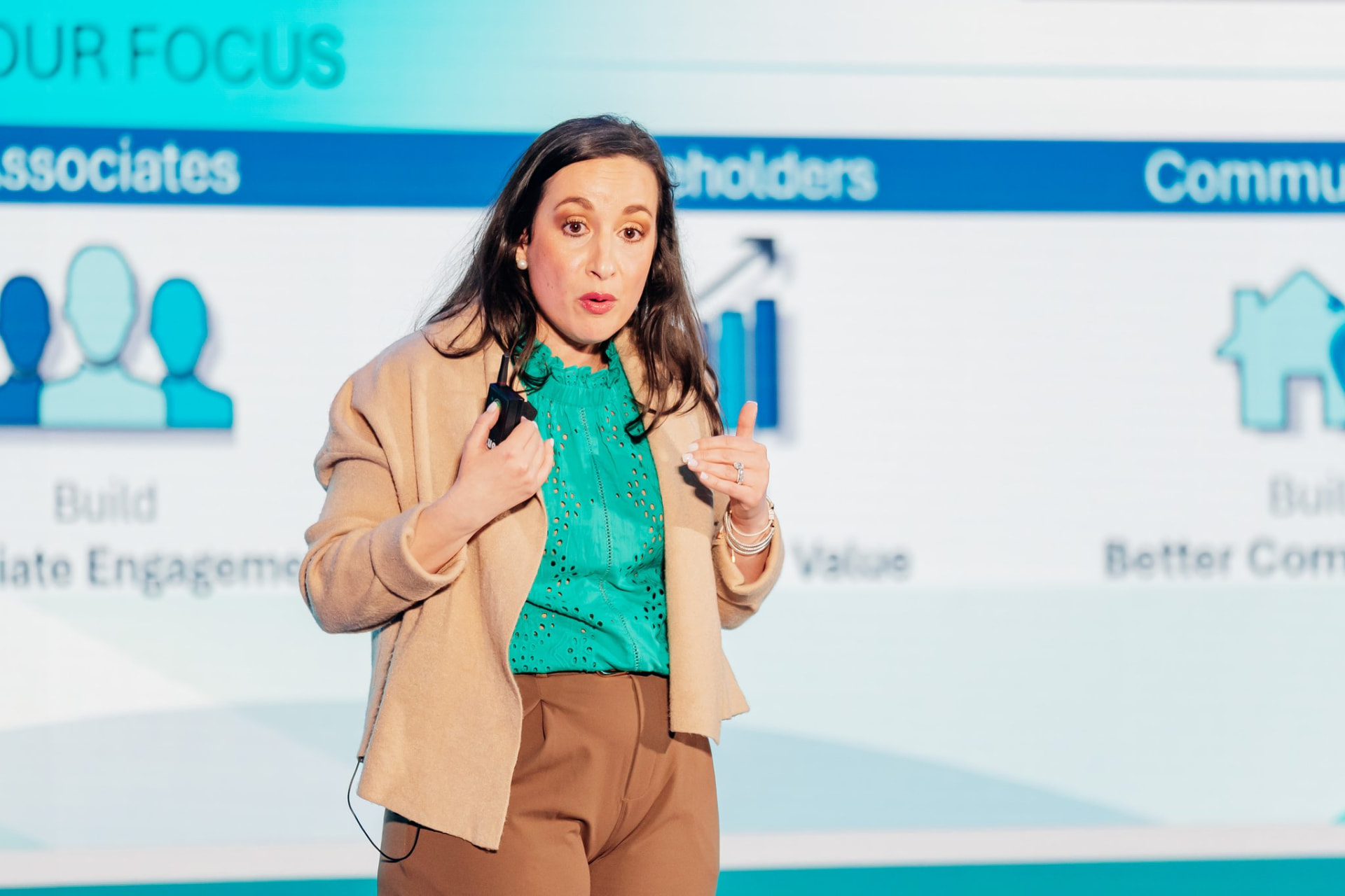 Corporate photography of a presenter with clicker addressing a corporate audience