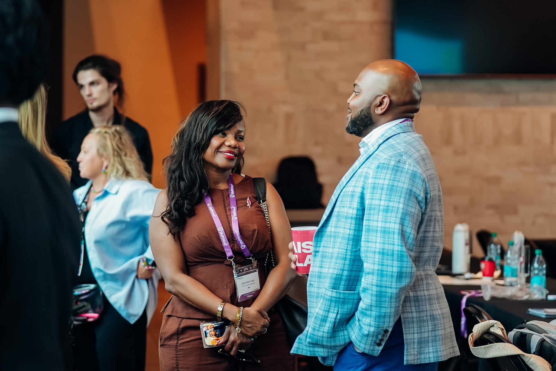 Corporate event photography of executives networking during a reception in Orlando, Florida