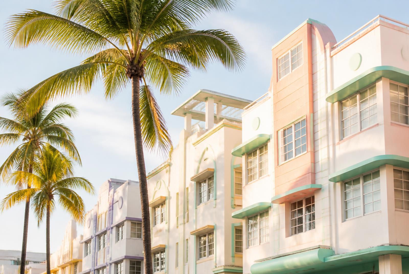 Palm trees in front of pastel Art Deco buildings on Ocean Drive in Miami Beach, Florida