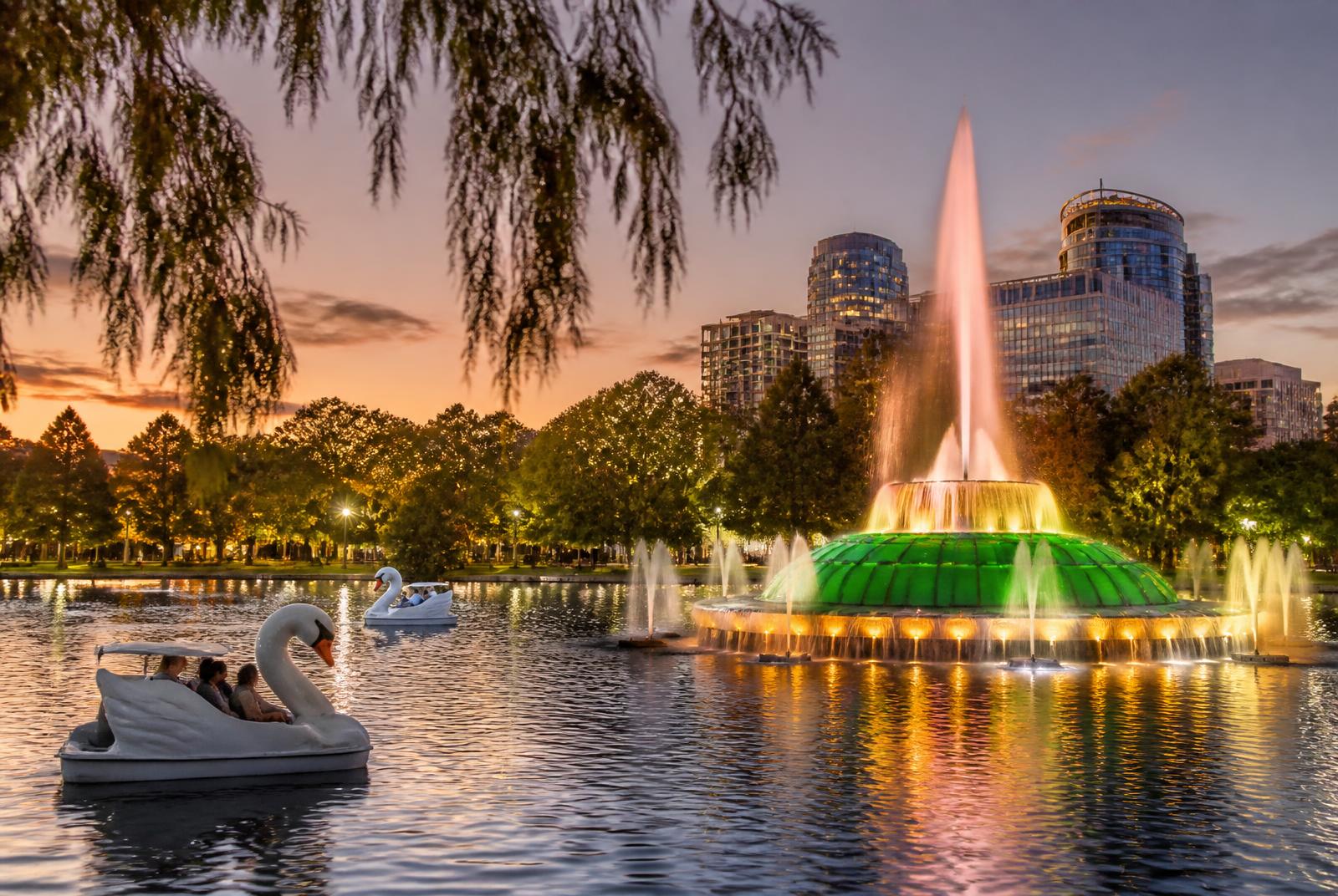 Lake Eola Park fountain and swan boats in downtown Orlando, Florida