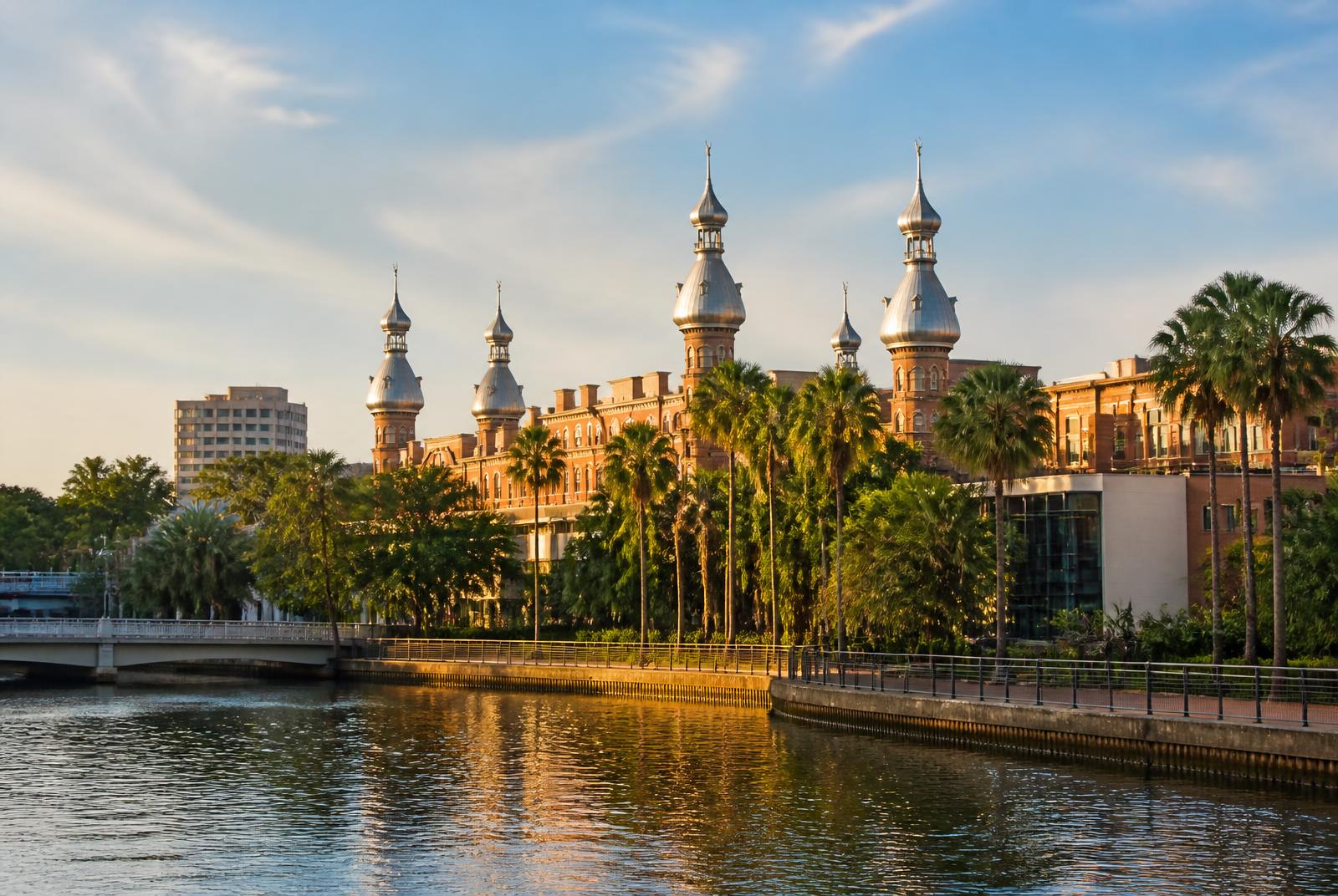 The historic University of Tampa minarets above the palm-lined Hillsborough River in Tampa, Florida